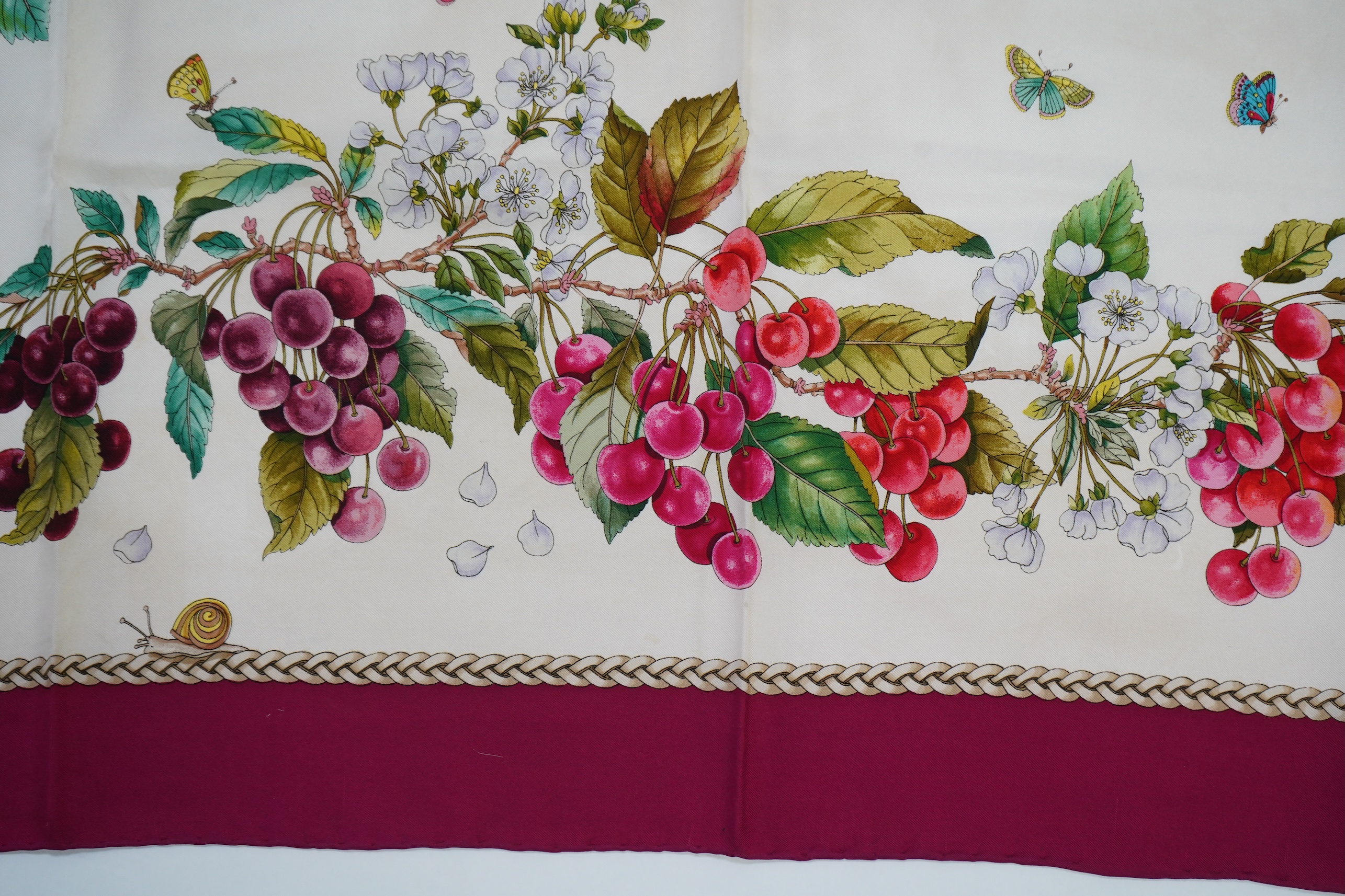 A vintage Gucci silk scarf with a design of strawberries and cherries, 86 x 87cm